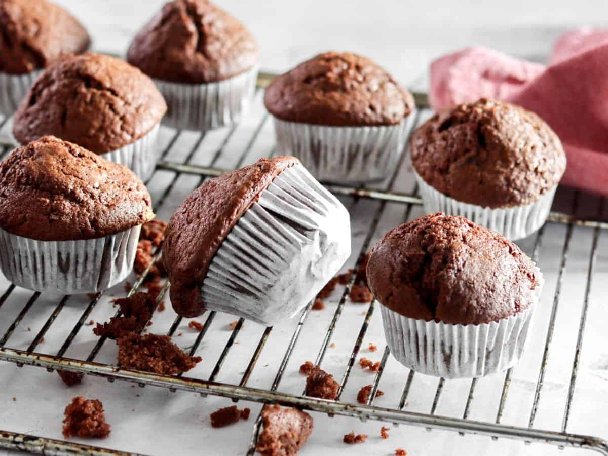 Chocolate sourdough cupcakes on a cooling rack.
