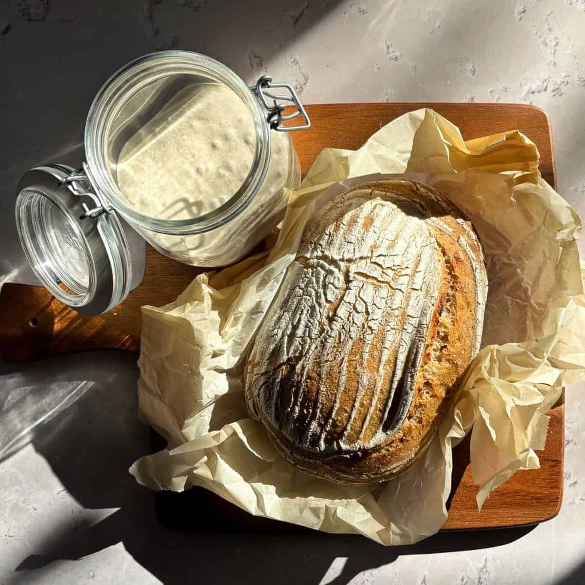Sourdough bread on a wooden cutting board.