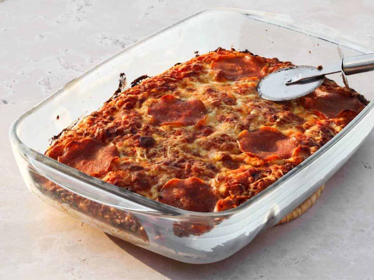 Sourdough focaccia pizza in a baking dish.