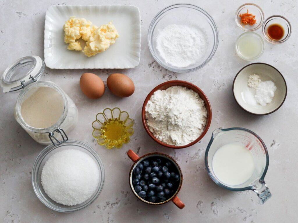 All the ingredients to make blueberry sourdough quick bread.