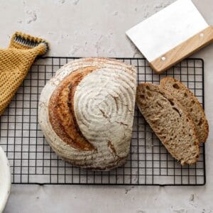 Sourdough whole wheat bread with slices.