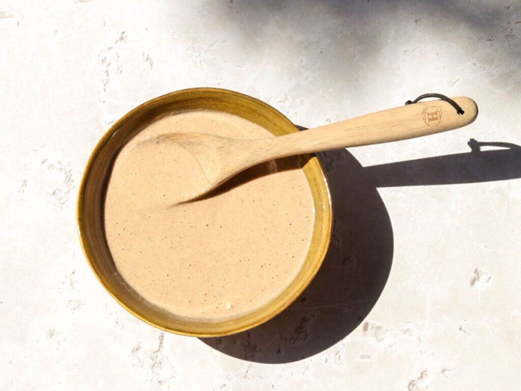 sourdough pumpkin pancake batter in a yellow bowl.