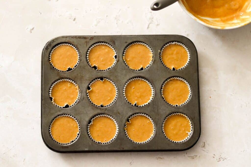 Cupcake liners filled with muffin batter.