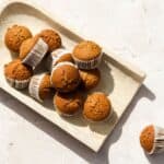 Twelve pumpkin sourdough muffins.