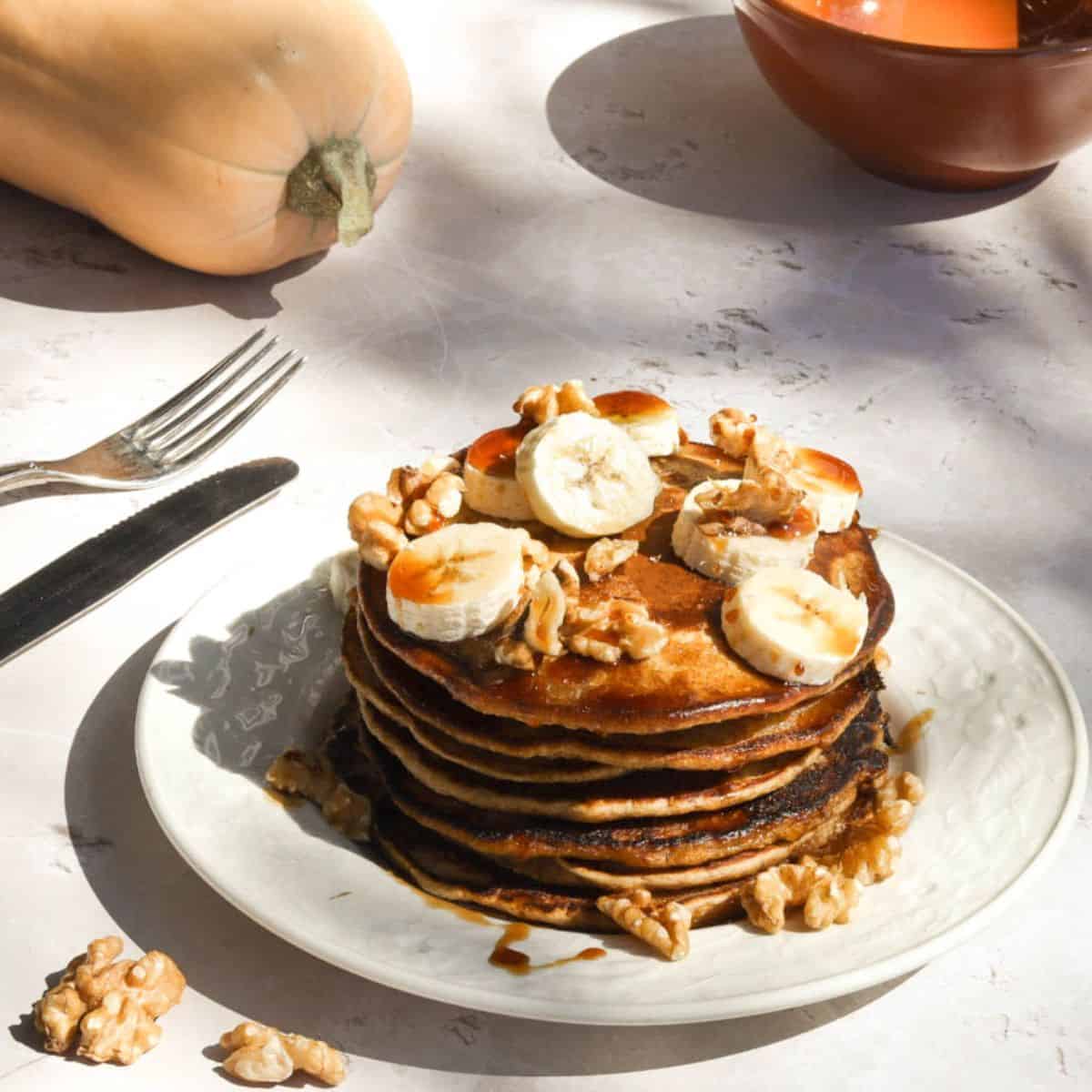 Pumpkin sourdough pancakes on a plate.