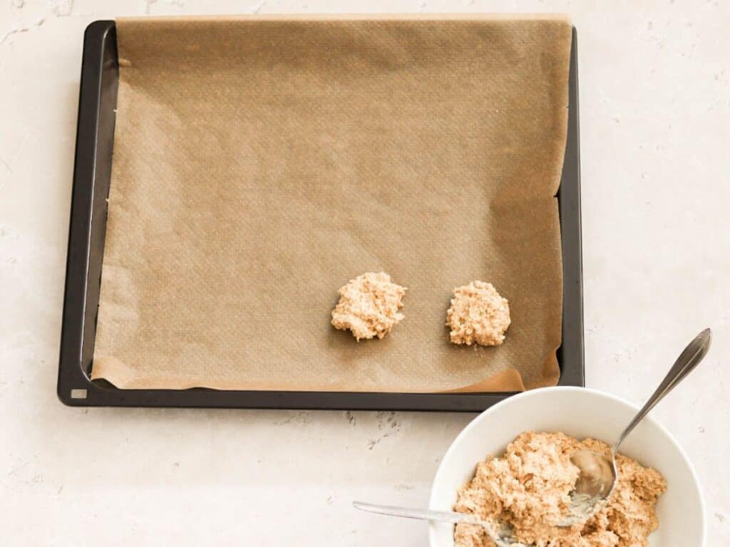 Shaping sourdough oatmeal cookies.