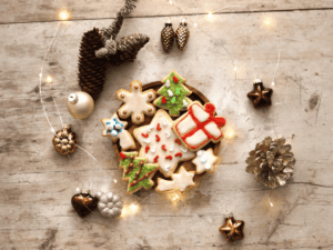 Christmas sugar cookies in a bowl with fairy lights.
