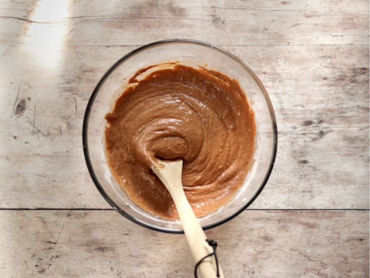 Mixed wet and dry ingredients for chocolate sourdough muffins.
