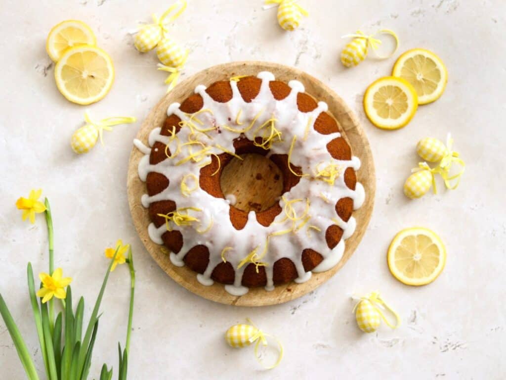 Lemon bundt cake with flowers and Easter eggs.