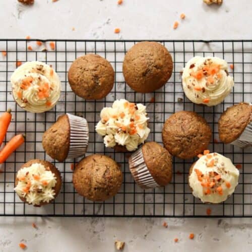Sourdough carrot cake muffins on a wire rack.