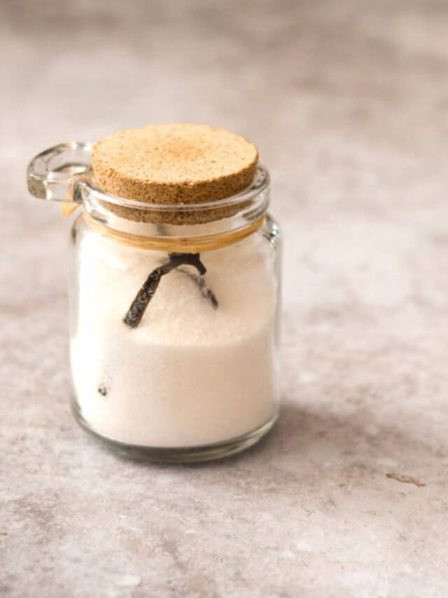 Homemade vanilla sugar in a glass jar.