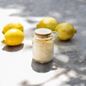 Homemade lemon sugar with fresh lemons.