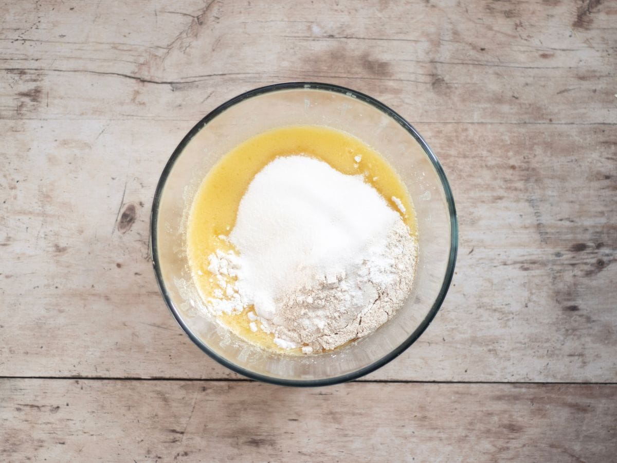 Mixing batter in a glass bowl.