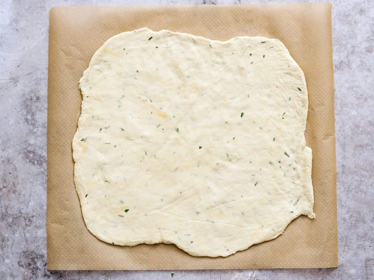 Rolling out the dough for sourdough discard crackers.