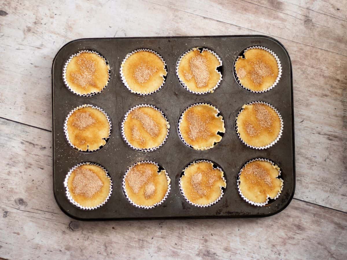 Sugar on top of gluten-free sourdough discard muffins.